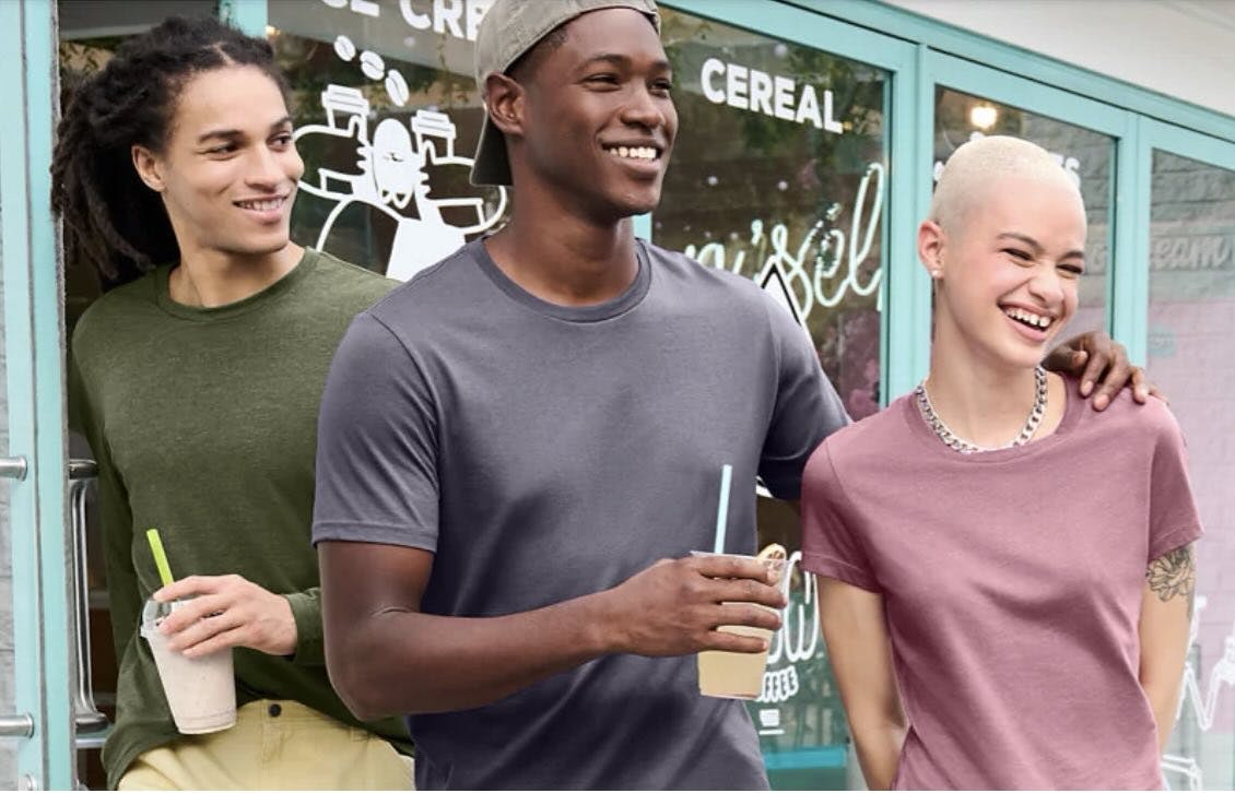 3 people smiling and wearing comfortable shirts